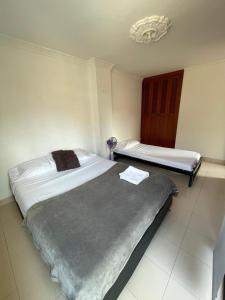 Postel nebo postele na pokoji v ubytování Apartamento Centro Histórico San Gil + 2 fotografie