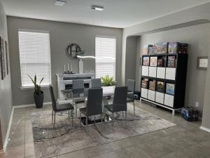 a dining room with a table and chairs at Relax with Spacious Modern Simplicity in Boerne