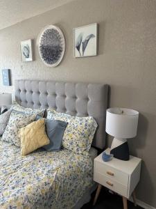 a bedroom with a bed and a lamp on a nightstand at Relax with Spacious Modern Simplicity in Boerne +23 photos