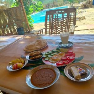 a table with different types of food on it at agyptus camp in Siwa