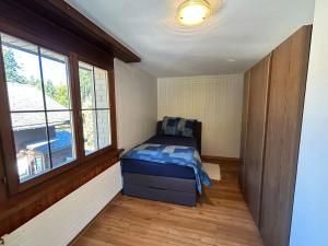 En eller flere senge i et værelse på Tannenheim Lodge Flumserberg