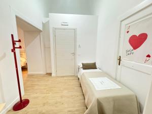 a room with a bed and a door with a table at META CC PALACE with pool in Meta