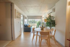 a kitchen and dining room with a table and chairs at Amazing Pool Apartments by Vacationy in Vila Nova de Gaia