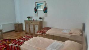 Ένα ή περισσότερα κρεβάτια σε δωμάτιο στο Casa Pelerinului +15 φωτογραφίες