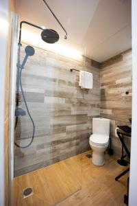 a bathroom with a toilet and a shower at Piraeus Harbor Hideaway in Piraeus +35 photos