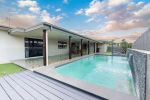 a swimming pool in the backyard of a house at Magic on MacArthur in Rosslea