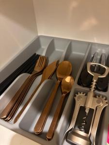 a tray of utensils sitting on top of a counter at Vacation house ITER in Hakodate