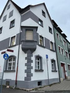 a white building with a window on the side of it at PaNi2 in Altdorf bei Nuernberg
