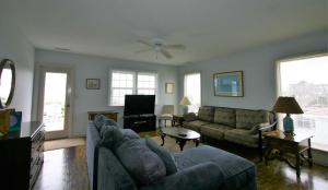 a living room with a couch and a table at Belvedere in Edisto Island