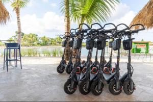 a row of scooters parked next to a beach at Luxury Villa in Vista Cana with Private Pool and BBQ in Punta Cana