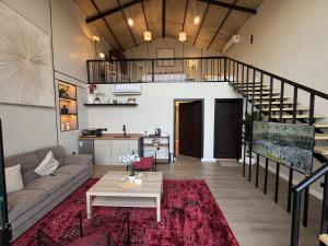 a living room with a couch and a table at غصن الهدا in Al Hada