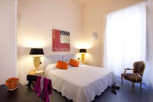 Ένα ή περισσότερα κρεβάτια σε δωμάτιο στο Canto dei Mille