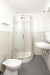 a bathroom with a shower and a toilet and a sink at Canto dei Mille in Florence