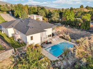 an aerial view of a house with a swimming pool at Epic Hillside Retreat Htd Pool HotTub Golf 4400sf in Boise