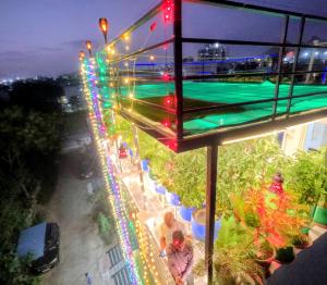 a view of a pool at night with christmas lights at CHOUDHARY WHITE HOUSE Udaipur in Udaipur +165 photos