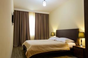 Voodi või voodid majutusasutuse Crystal Hill Resort toas