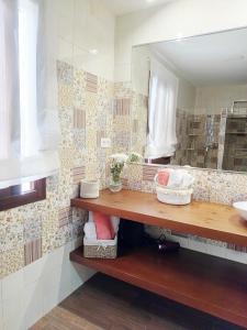 a bathroom with a sink and a mirror at Casa Centinela in Antequera +44 photos