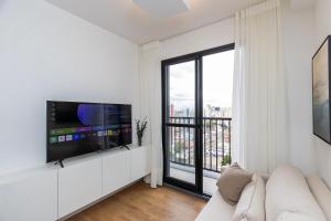 TV a/nebo společenská místnost v ubytování Apartamento de 2 Quartos com Garagem - IBI2309