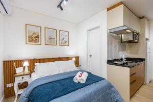 En eller flere senge i et værelse på Studio no LOG Centro de Curitiba - LOG0311