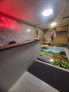 a lobby with a swimming pool in the middle of a room at Hotel de Bruxelles in Brussels