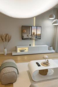a living room with a tv on the wall at Belgrade Waterfront Nostra Casa in Sajmište