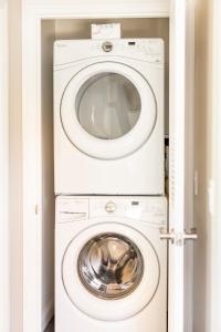 a white washer and dryer in a room at Wine Country Private Backyard and Bocci Ball in Atascadero