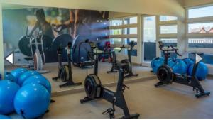a gym with a bunch of exercise bikes in a room at Departamento estudio in Osorno