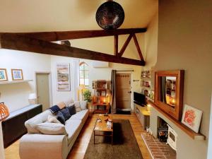 a living room with a couch and a table at The Annexe in Newark-on-Trent