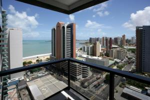 a view of the beach from a balcony of a building at Beira-Mar Flat Venetto - Premium in Fortaleza