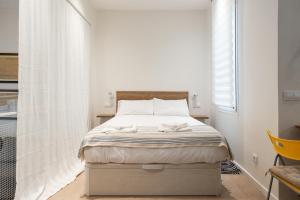 Postel nebo postele na pokoji v ubytování Premium loft in the center of Madrid, Casa García