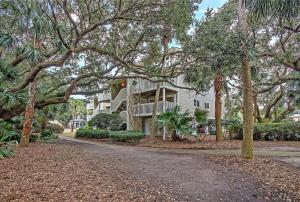 a large white house with trees in front of it at SG6A: 6A Seagrove Villa in Isle of Palms
