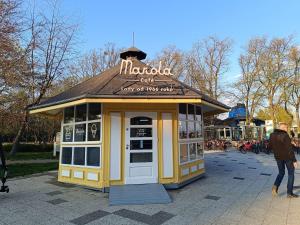 a small yellow building with a sign on top of it at 2-room apartment, central & quiet in Gdynia