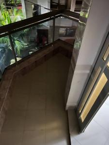 an empty hallway in a building with a glass floor at Elzo Crib !!! in Dakar