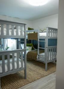 two white bunk beds in a room with a bed at LUX NEW! Heated Pool Option, 2Kings, Spa, Old Town, WestWorld, Fashion Square in Scottsdale +44 photos