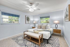 a bedroom with a bed and a ceiling fan at Siesta Dolce - 3750 in Siesta Key +58 photos