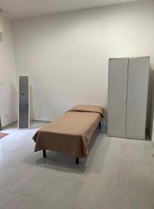 Ένα ή περισσότερα κρεβάτια σε δωμάτιο στο bilocale mirabilandia