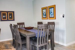 a dining room table with four chairs and a table and chairsktop at BEACHVIEW 110 condo in South Padre Island