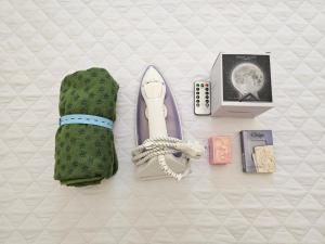 a pair of gloves and other items on a bed at 어반 팀버 수원 in Hagwanggyo-dong