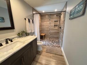 a bathroom with a shower with a toilet and a sink at Sea Urchin - Amazing Private Suite Large Bath 3.3mi 2 Beach in Bonita Springs