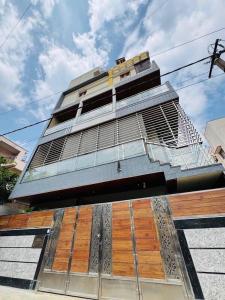 a tall building with a balcony on the side of it at Ultra Luxurious 4 BHK VILLA in Bengaluru