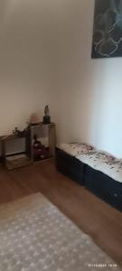 a room with two beds in the corner of a room at alojamiento a pasos del casino dreams y zona gourmet in Punta Arenas