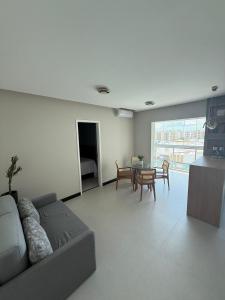 a living room with a couch and a table at Comfort Jardins II - Em frente ao Shopping- Neo Residence in Aracaju +47 photos