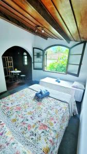 Una cama o camas en una habitación de Pousada Shemah em Penedo