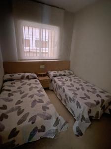 Postel nebo postele na pokoji v ubytování Anamar Dorada