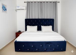 Postel nebo postele na pokoji v ubytování WF Hotels