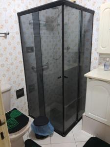 a shower with a glass door in a bathroom at Aunt A CASA DOS SONHOS DA TIA LETÍCIA in Miguel Pereira +39 photos