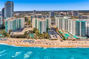an aerial view of a beach and buildings at Beachfront 2BR at The Tides | EPIC Stay in Hollywood