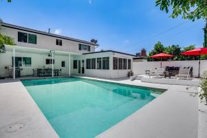 a swimming pool in the backyard of a house at Vacation House with Pool in Garnsey