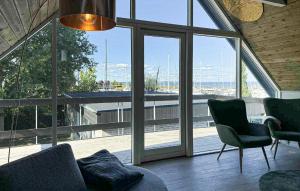 a room with a large window with chairs and a table at Cozy Home In Haderslev With Wifi in Haderslev