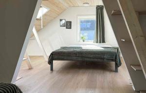 a bedroom with a bed in a room with a window at Cozy Home In Haderslev With Wifi in Haderslev